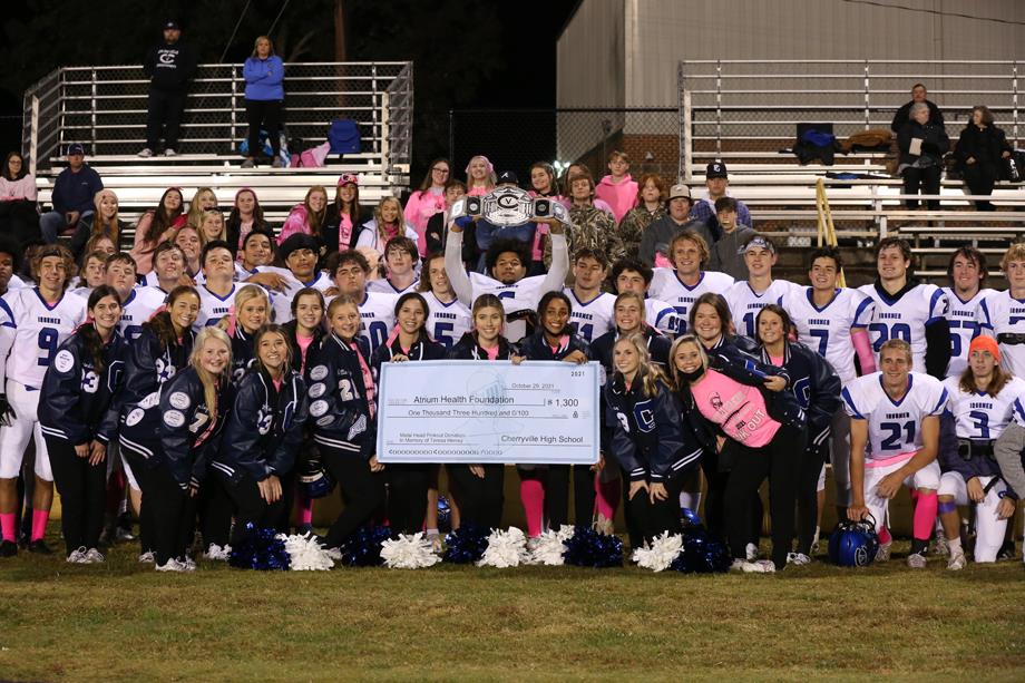 During the Cherryville High School and Bessemer City High School “pink out” football game, the schools raised money for two non-profit organizations. Bessemer City High School donated $1,000 to Relay for Life and Cherryville High School donated $1,300 to the Atrium Health Foundation.